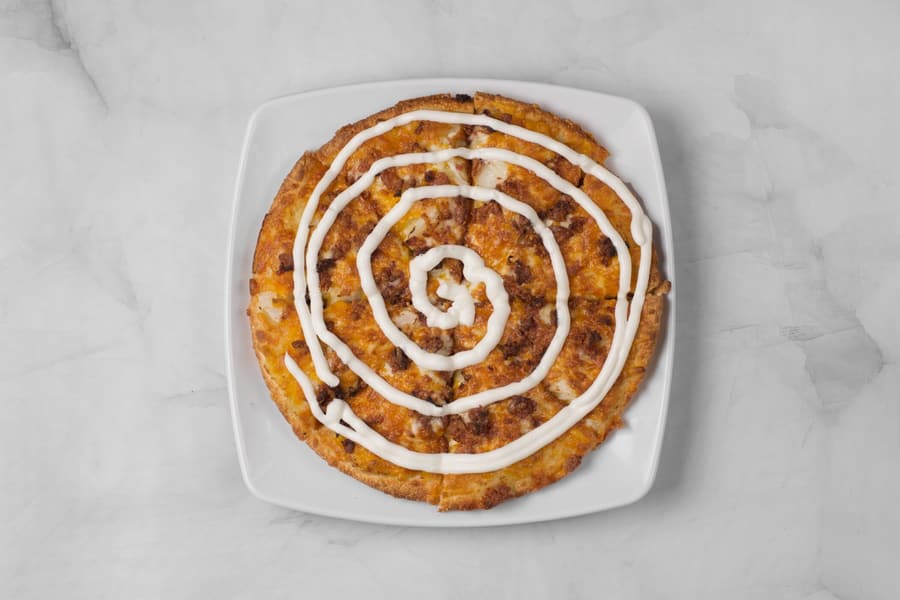 Perogy pizza with sour cream