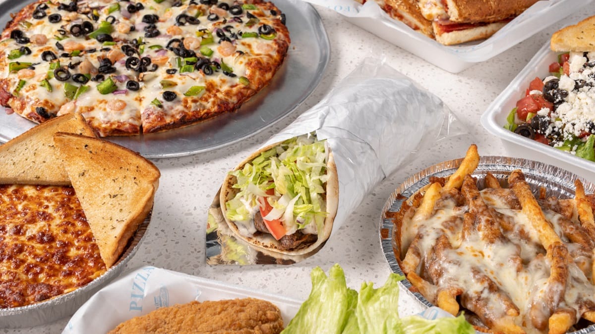 A spread of UFO Pizza favourites: pizza, donair, cheese bread and donair poutine